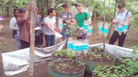 ICS Volunteers visiting a vegetable garden constructed by the previous cycle of volunteers