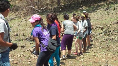 Volunteers collecting rocks for their eco-construction