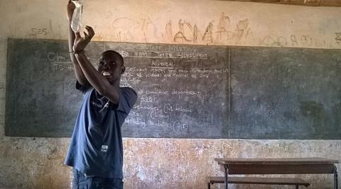 National volunteer facilitating a condom demonstration