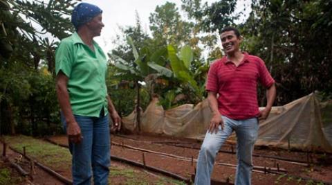 Amparo Jimenez and Bernardo Lopez in food garden