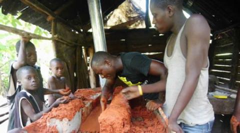 Gabriel Petit-Homme building an eco stove in Gens de Nantes