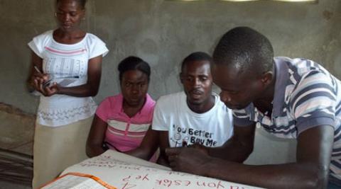 Four villagers at the cassava training workshop