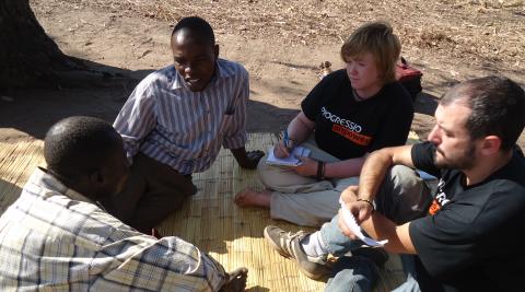 ICS volunteers talking with Malawian people