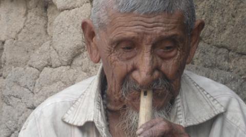 Don Marcelino Galicia playing the recorder