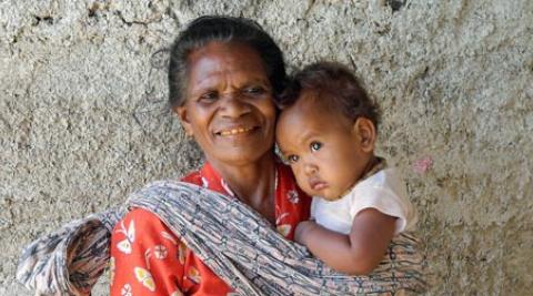 Rosa Dos Santos, 63, with grandchild in Timor-Leste