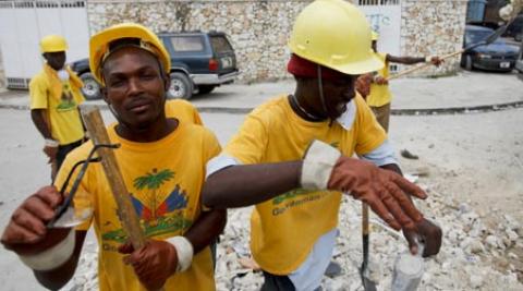 Haitian workers clear rubble in streets of Port-au-Prince