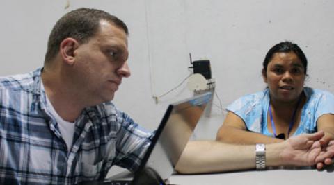 Jim Matarazzo with woman interviewee in El Salvador