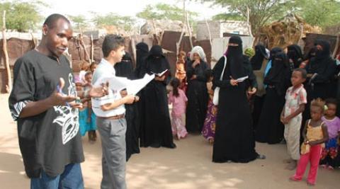 Joseph Aloo discussing community needs with women in Hodeidah Yemen