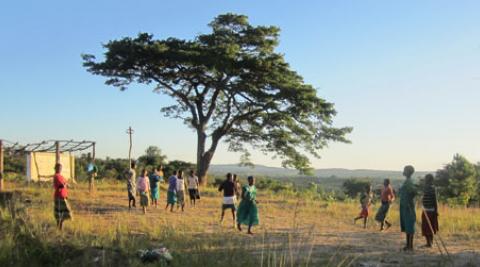 Girls playing in field in Mzimba, Malawi