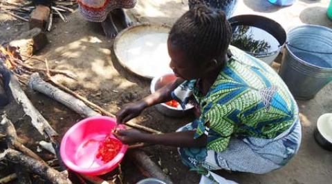 A woman preparing food in Malawi