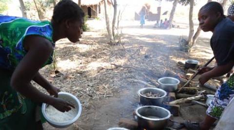 Women cooking in a village in Malawi