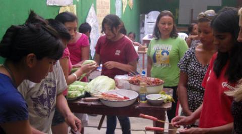 Preparing food at market stall