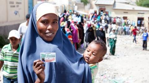 A woman in Somaliland holding her voting card on election day