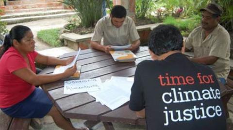 Time for Climate Justice campaigners sit around the table