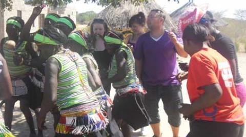 Volunteers dancing with the Lubu cultural dance group 