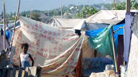 Haitian women selling mangoes amid the rubble