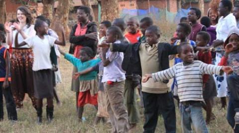 Volunteers playing bulldog with local children