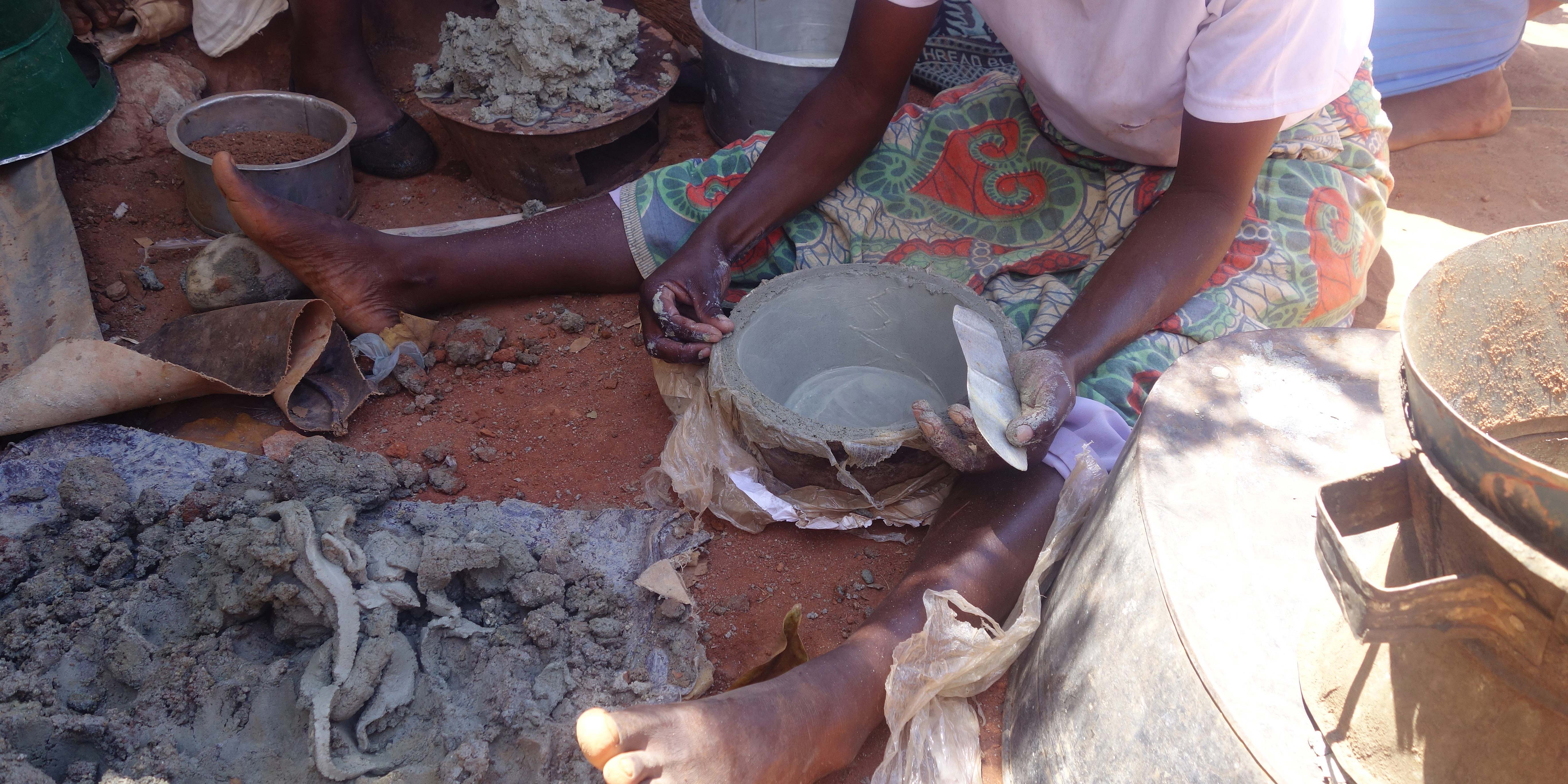 Visiting local women who make clay stoves